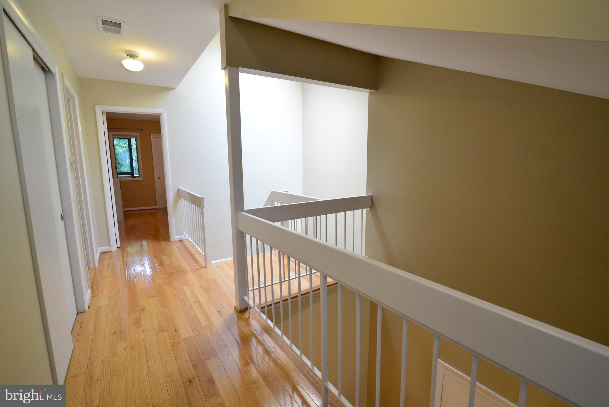 2268 Cedar Cove Court Reston, VA 20191 - Photo 26 of 41 The stairs and hall feature hardwoods, too.