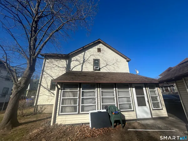 a front view of a house with garage