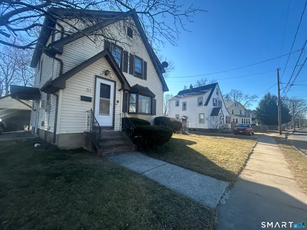 a view of a house with a yard