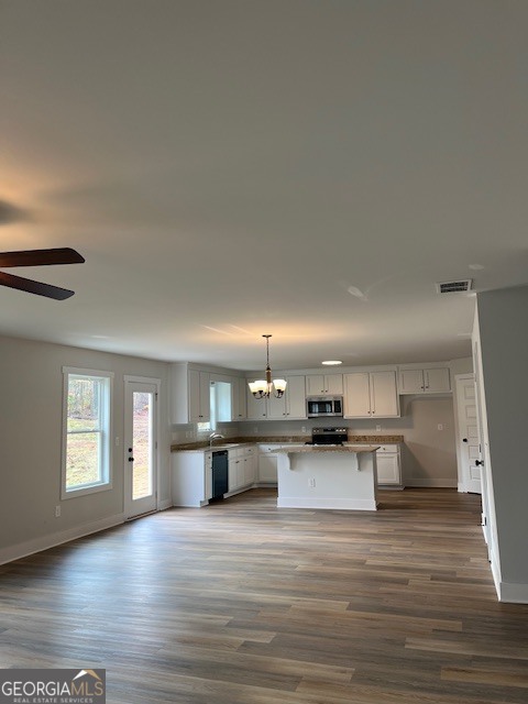 457 Riley Circle Northwest Milledgeville, GA 31061 - Photo 3 of 16 a view of a kitchen with a sink and a stove