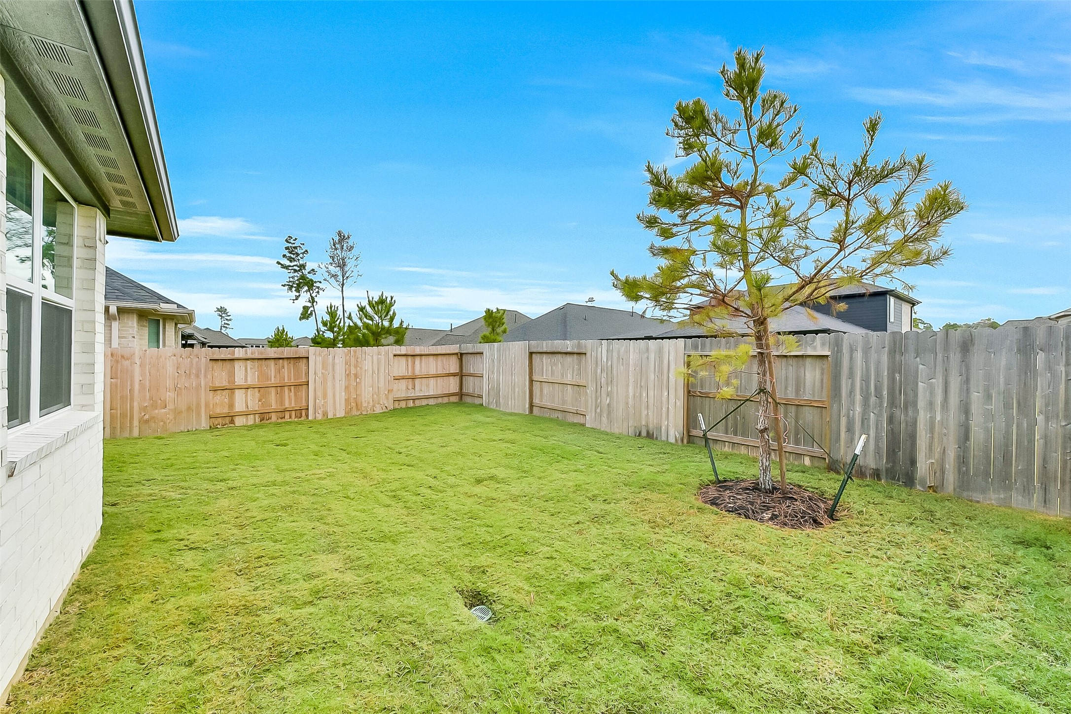 16323 Placid Stream Street Conroe, TX 77302 - Photo 32 of 36 a house view with a garden space