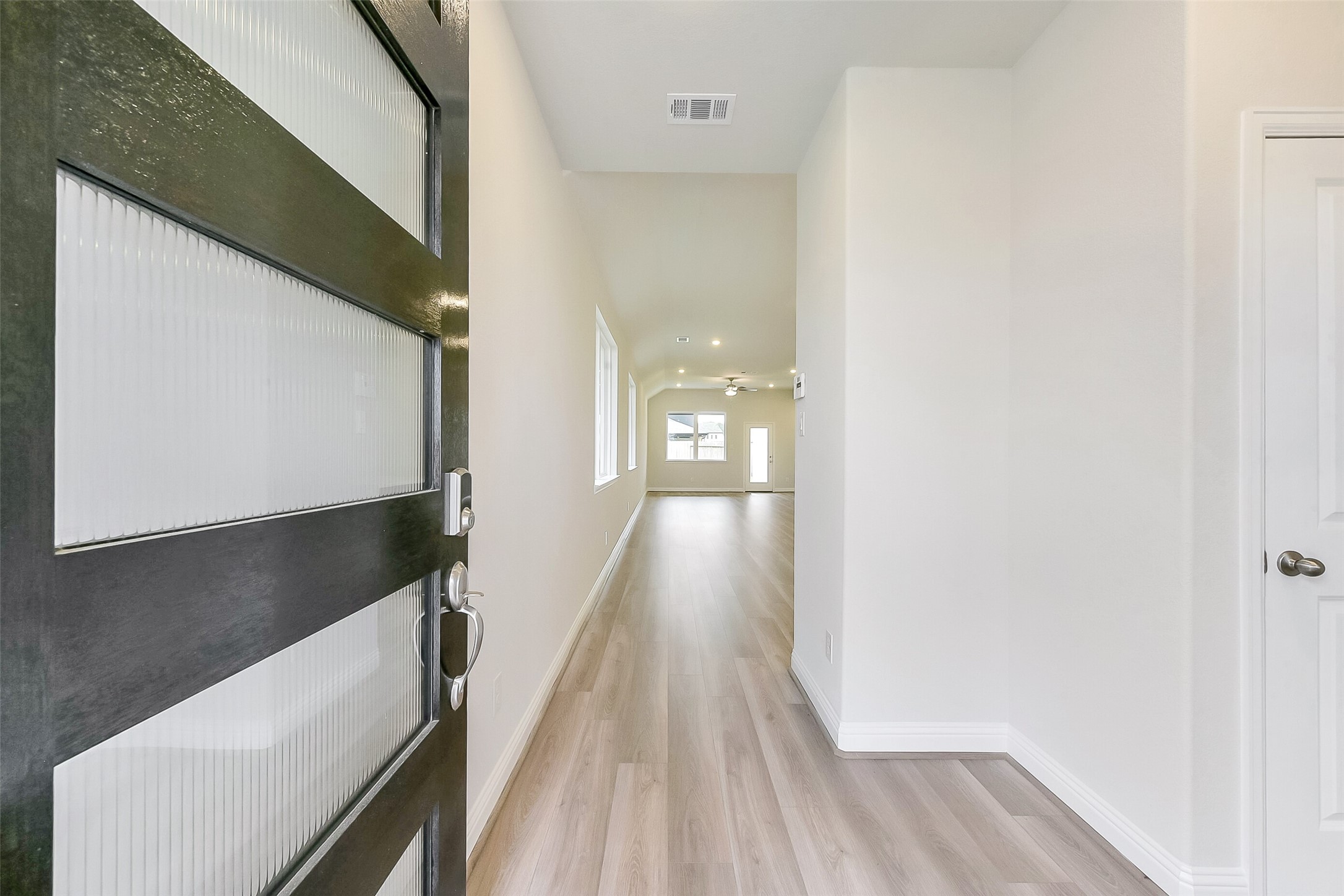 16323 Placid Stream Street Conroe, TX 77302 - Photo 4 of 36 a view of hallway with wooden floor