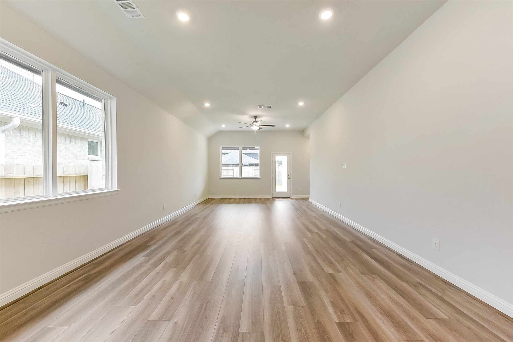 16323 Placid Stream Street Conroe, TX 77302 - Photo 5 of 36 a view of empty room with wooden floor and fan