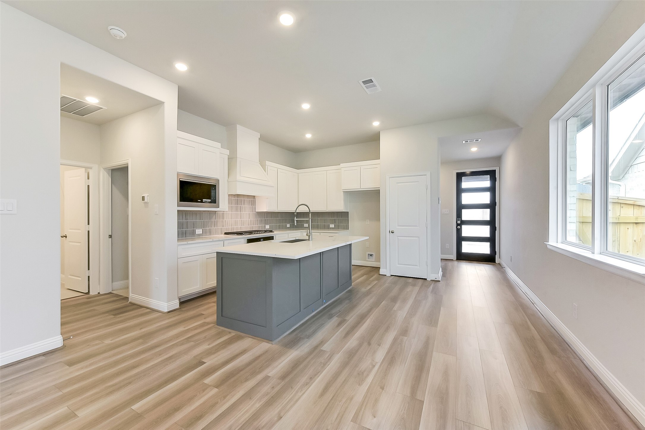 16323 Placid Stream Street Conroe, TX 77302 - Photo 9 of 36 a large kitchen with a lot of counter space and stainless steel appliances