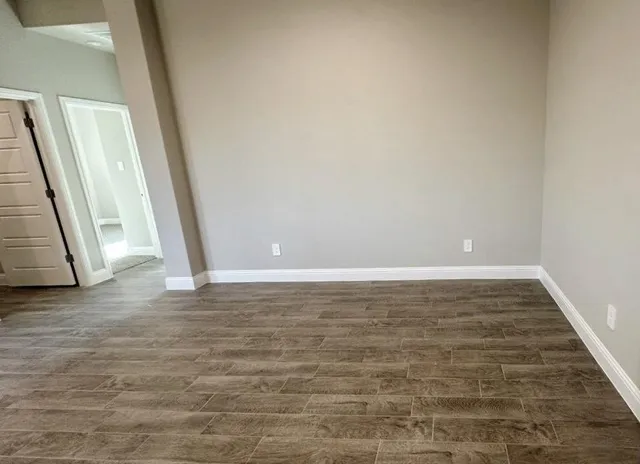 a kitchen with kitchen island granite countertop a sink stainless steel appliances and cabinets