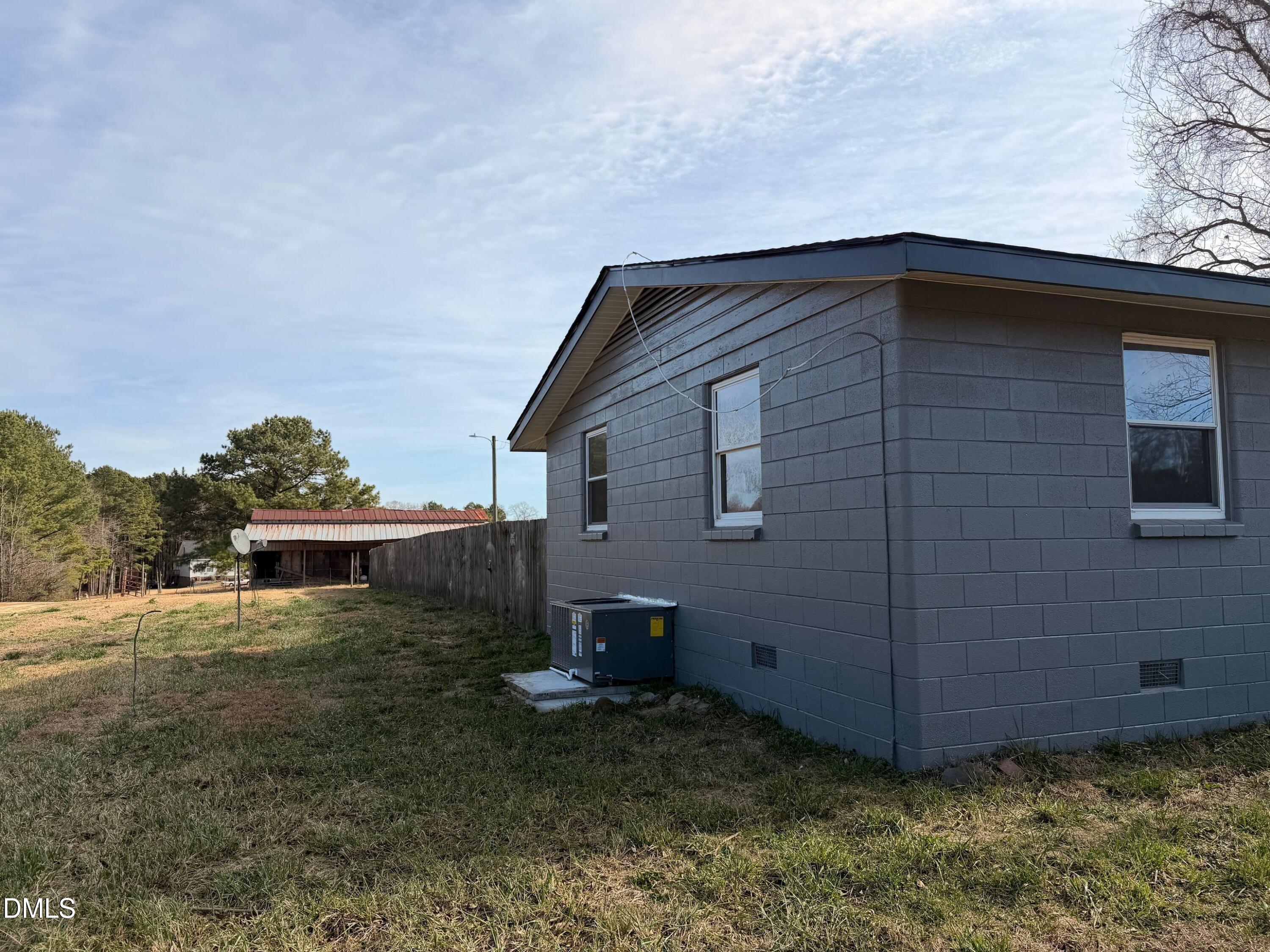 206 W Road Angier, NC 27501 - Photo 2 of 23 a backyard of a house with lots of green space