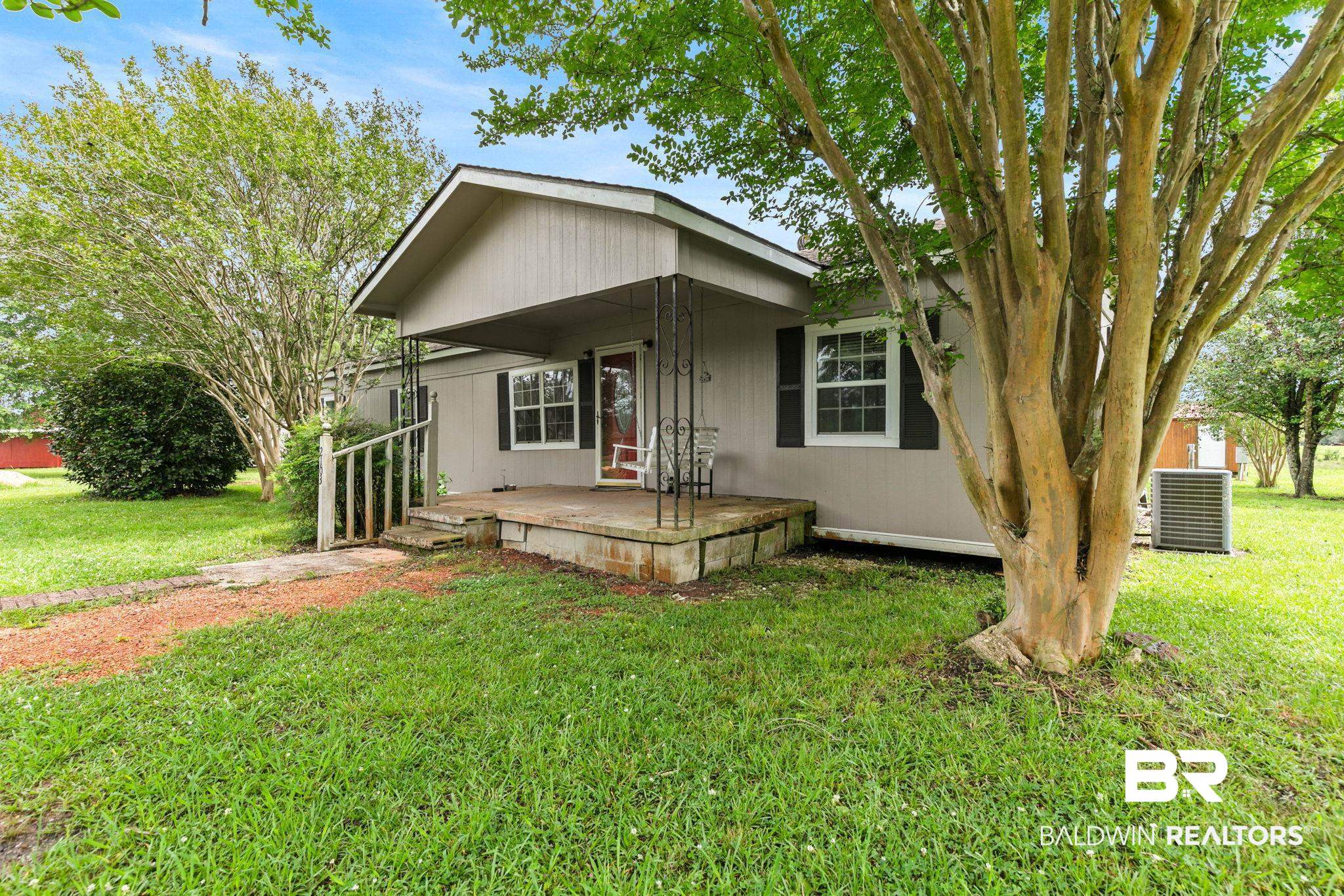 2029 George Lee Road Repton, AL 36475 - Photo 52 of 58 Single-story property with a covered front porch featuring wrought iron supports