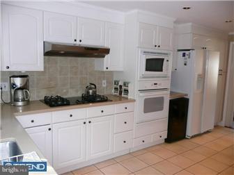 1210 Wedgewood Road Flourtown, PA 19031 - Photo 3 of 12 a kitchen with white cabinets and sink