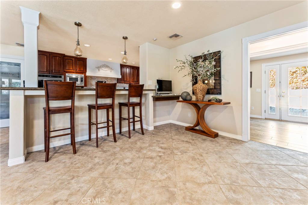 5737 Peridot Avenue Rancho Cucamonga, CA 91701 - Photo 15 of 40 a view of a livingroom with furniture and a flat screen tv