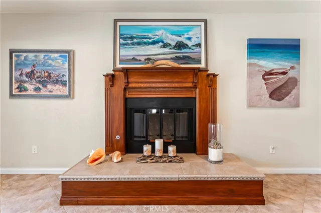 a living room with furniture a large window and a flat screen tv