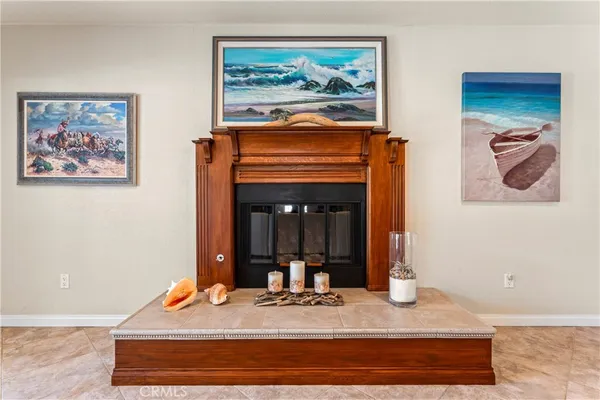 a living room with furniture a large window and a flat screen tv