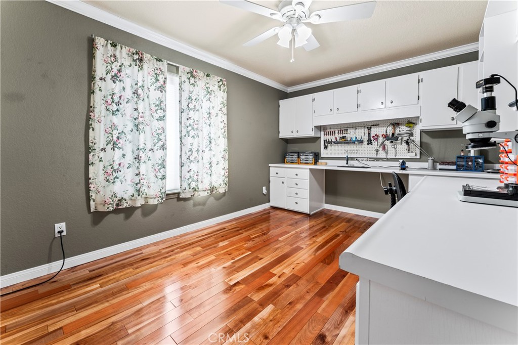 5737 Peridot Avenue Rancho Cucamonga, CA 91701 - Photo 26 of 40 a room with stainless steel appliances kitchen island a large counter space and wooden floor