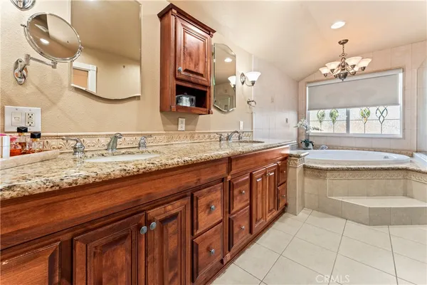 a spacious bathroom with a bathtub and toilet