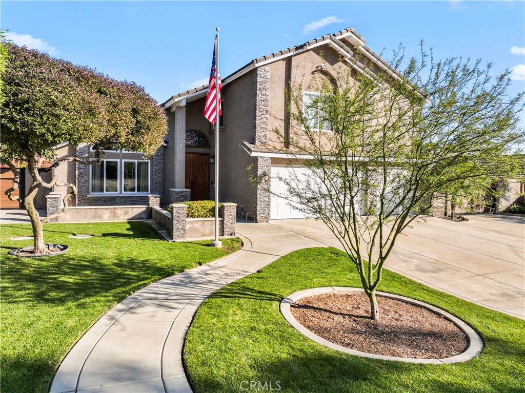 5737 Peridot Avenue Rancho Cucamonga, CA 91701 - Photo 35 of 40 a front view of a house with a yard