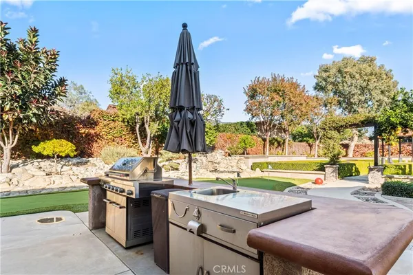 a view of a swimming pool with an outdoor space and seating area