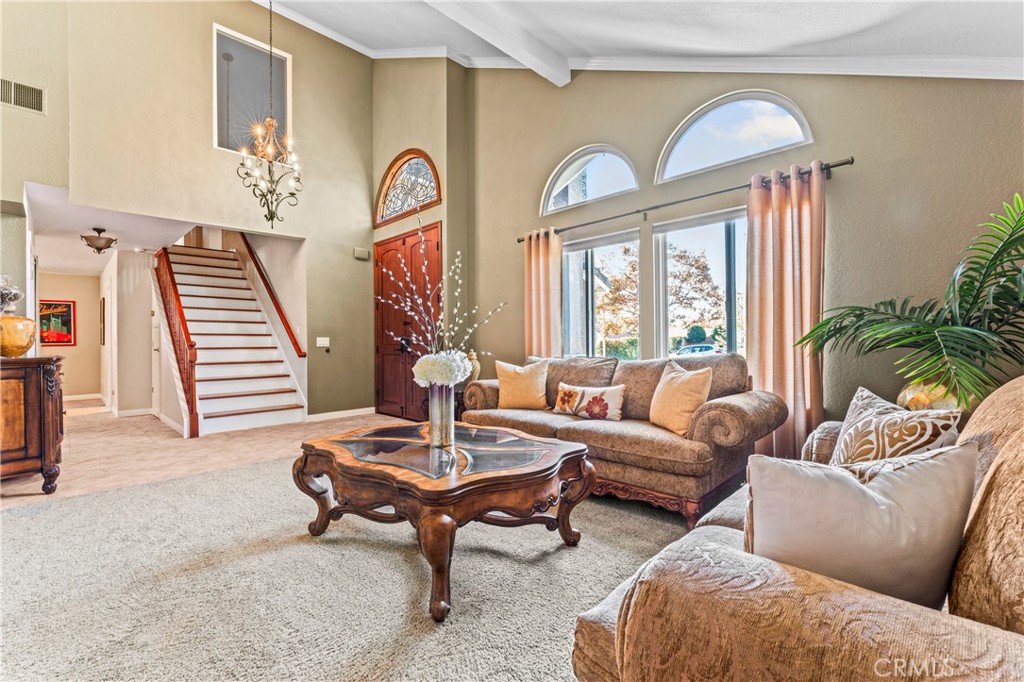 5737 Peridot Avenue Rancho Cucamonga, CA 91701 - Photo 9 of 40 a living room with furniture and a large window