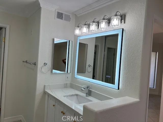 a view of a hallway with wooden shelves