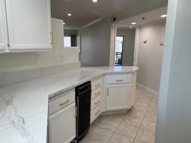 a kitchen with a sink cabinets and stove