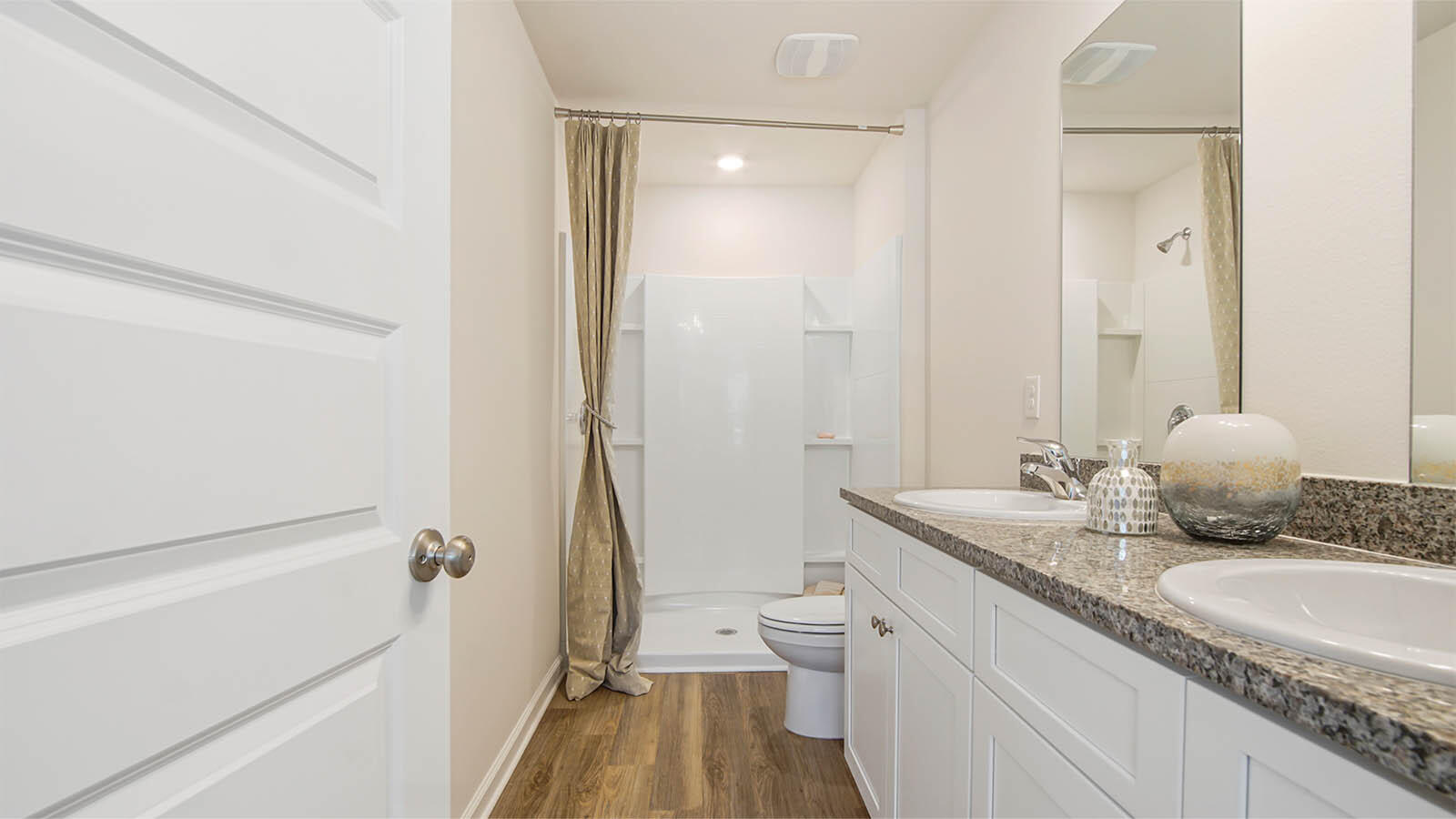127 Dockside Road Freeport, FL 32439 - Photo 16 of 28 a bathroom with a granite countertop sink a mirror and a bathtub