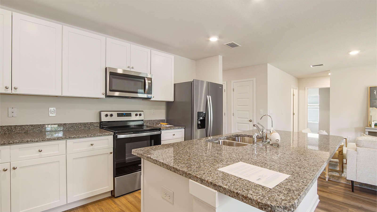 127 Dockside Road Freeport, FL 32439 - Photo 5 of 28 a kitchen with stainless steel appliances granite countertop a sink a stove and a refrigerator