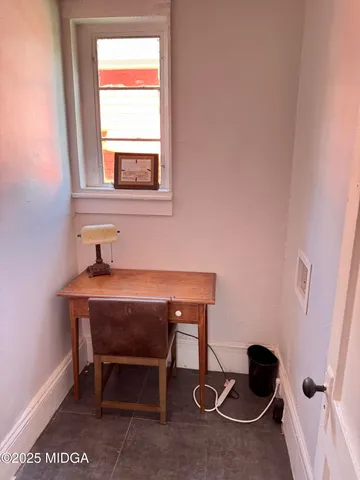 a room with a table and windows