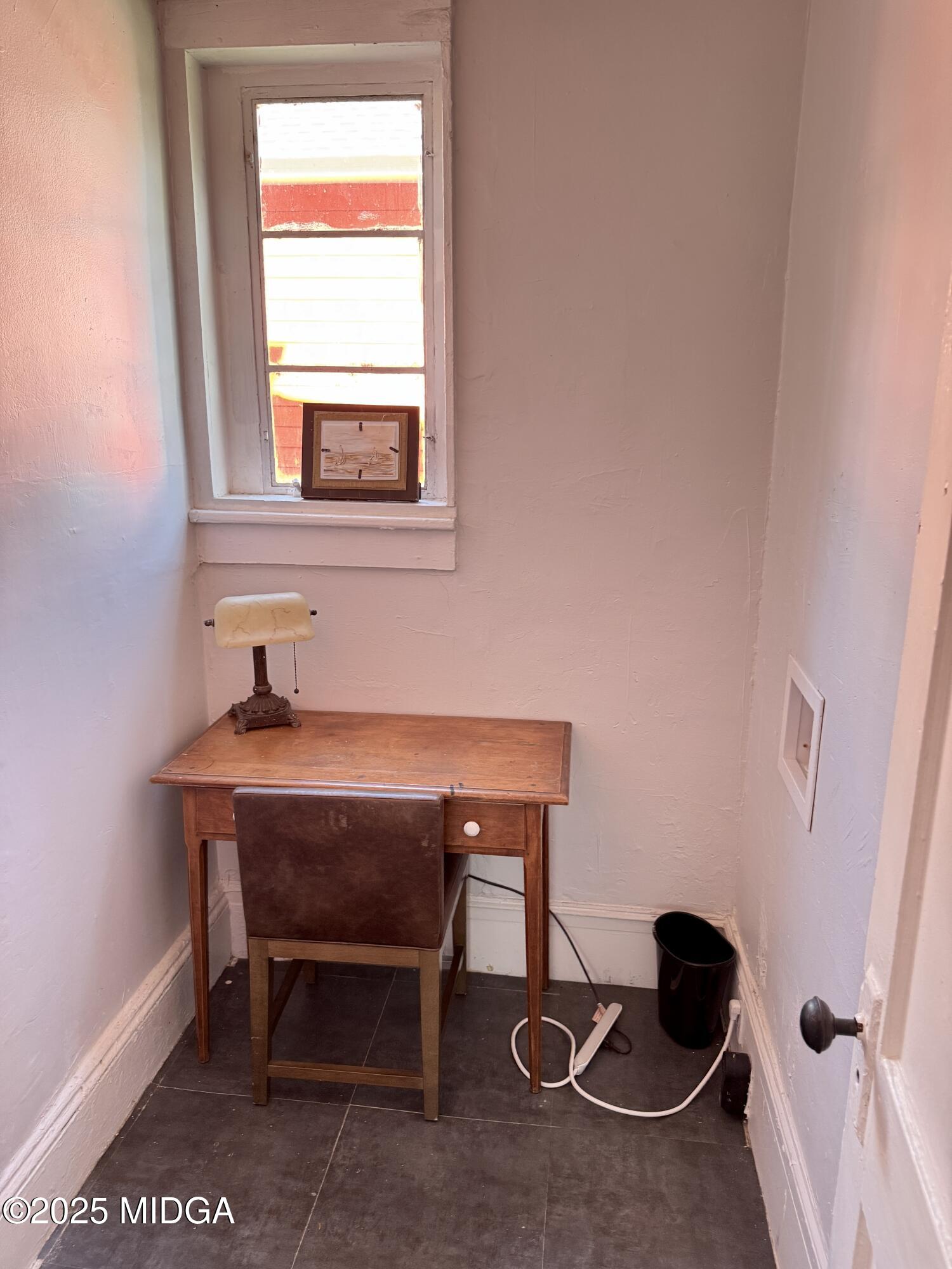 1687 Lawton Avenue Macon, GA 31201 - Photo 11 of 22 a room with a table and windows