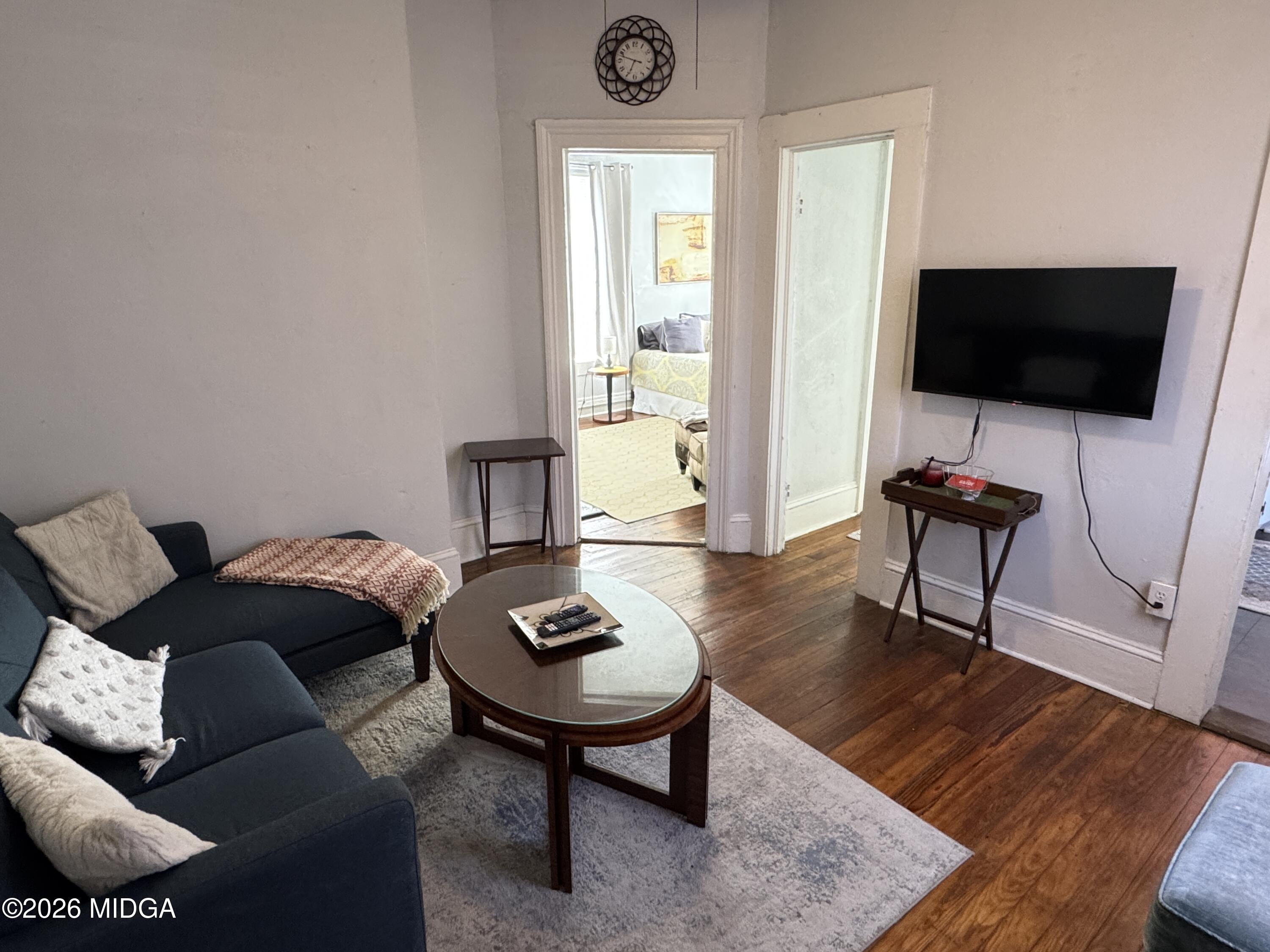 1687 Lawton Avenue Macon, GA 31201 - Photo 14 of 22 a living room with furniture and a flat screen tv