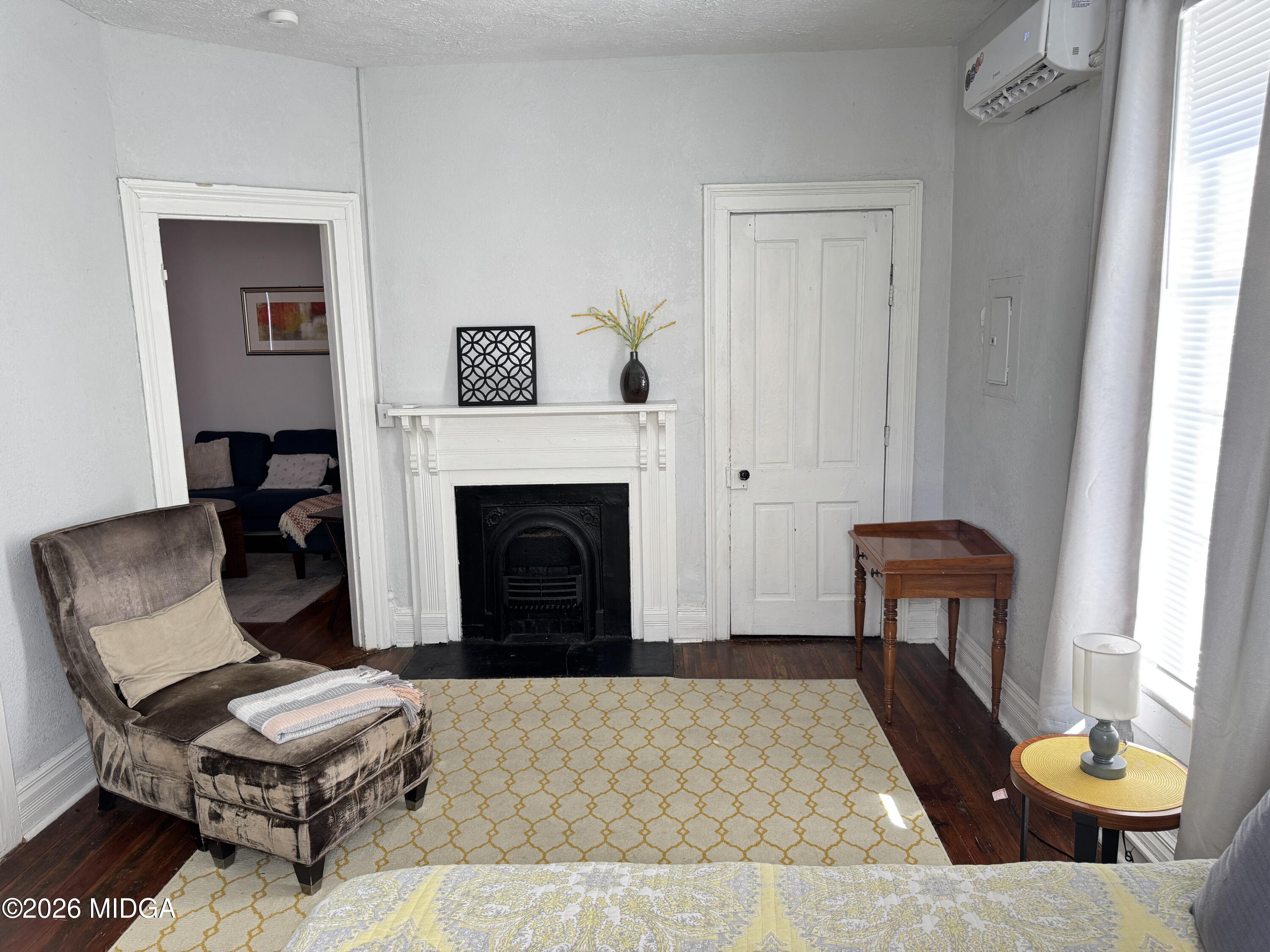1687 Lawton Avenue Macon, GA 31201 - Photo 16 of 22 a living room with furniture and a fireplace