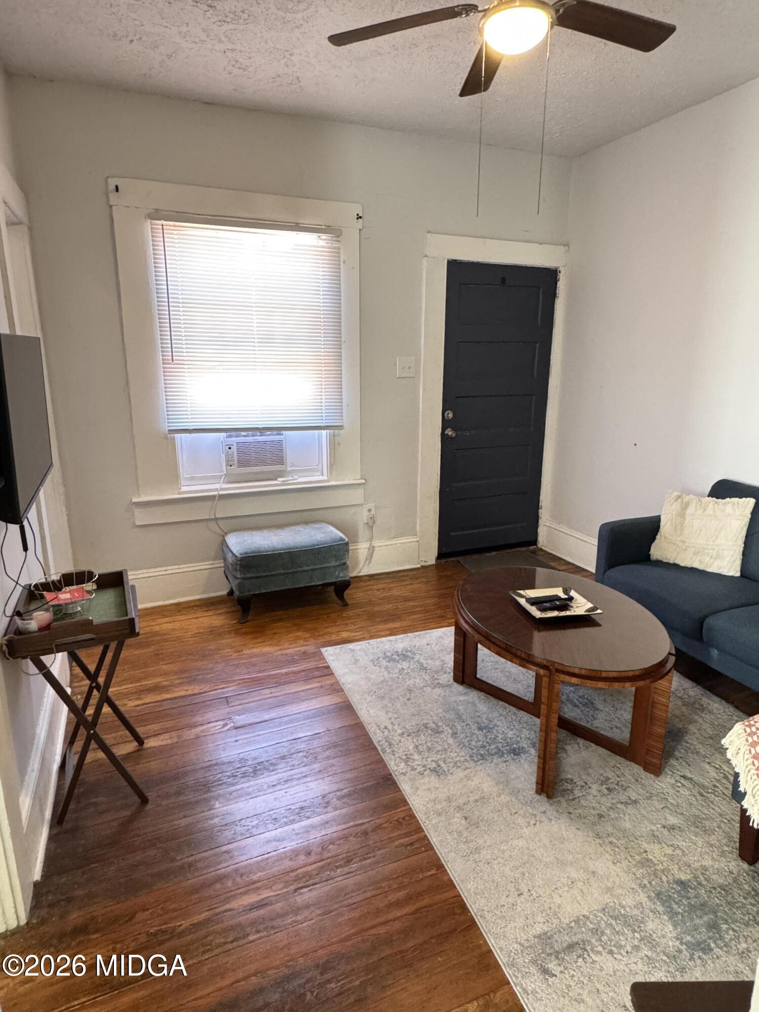 1687 Lawton Avenue Macon, GA 31201 - Photo 22 of 22 a living room with furniture and a flat screen tv