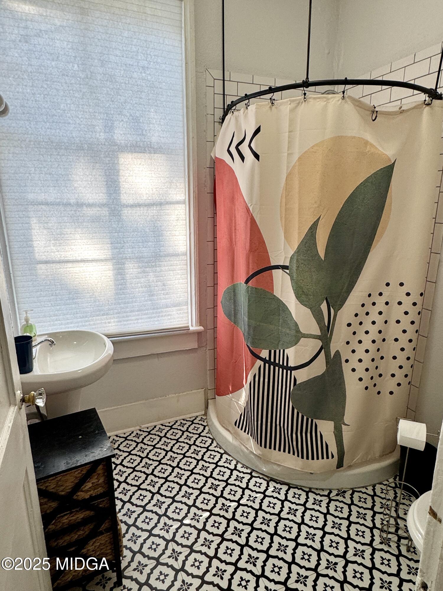 1687 Lawton Avenue Macon, GA 31201 - Photo 7 of 22 a bathroom with a sink toilet and shower