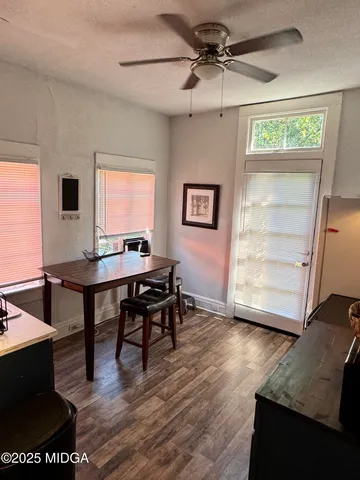a workspace with furniture window and wooden floor
