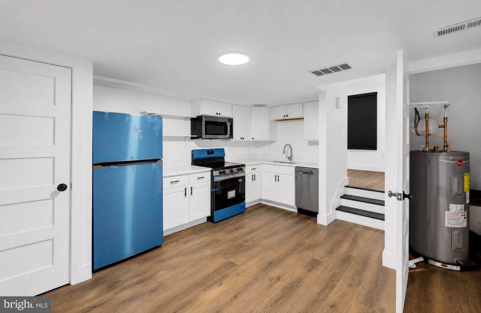 2731 Round Road Baltimore, MD 21225 - Photo 2 of 26 Modern kitchen with vibrant accents.