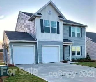 219 Hidden Lakes Road Statesville, NC 28677 - Photo 1 of 1 a front view of a house with garden