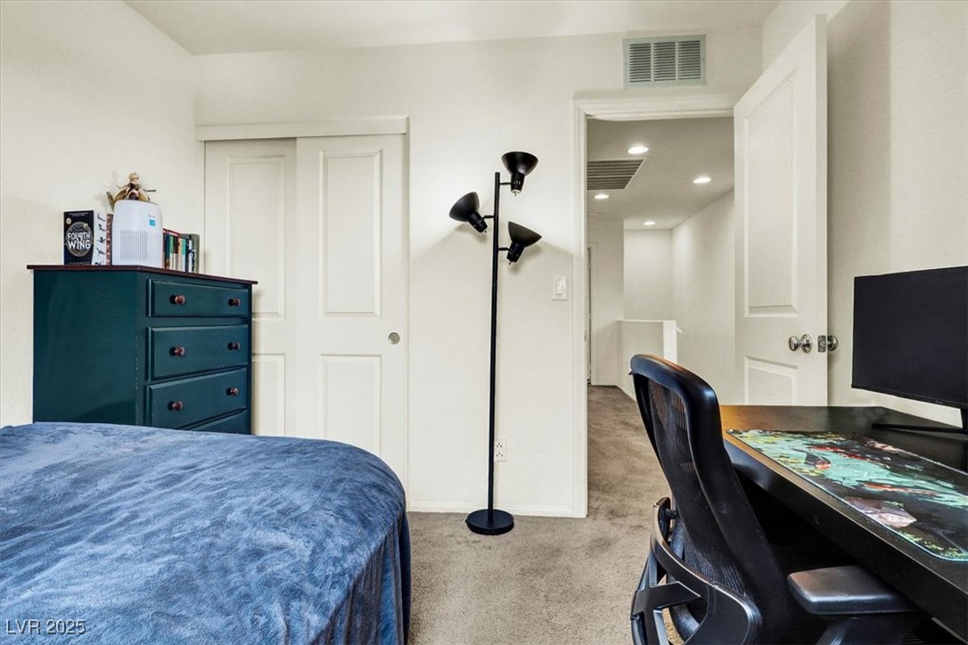 9236 Keystone Ridge Avenue Las Vegas, NV 89148 - Photo 33 of 38 Bedroom with carpet floors, and closet
