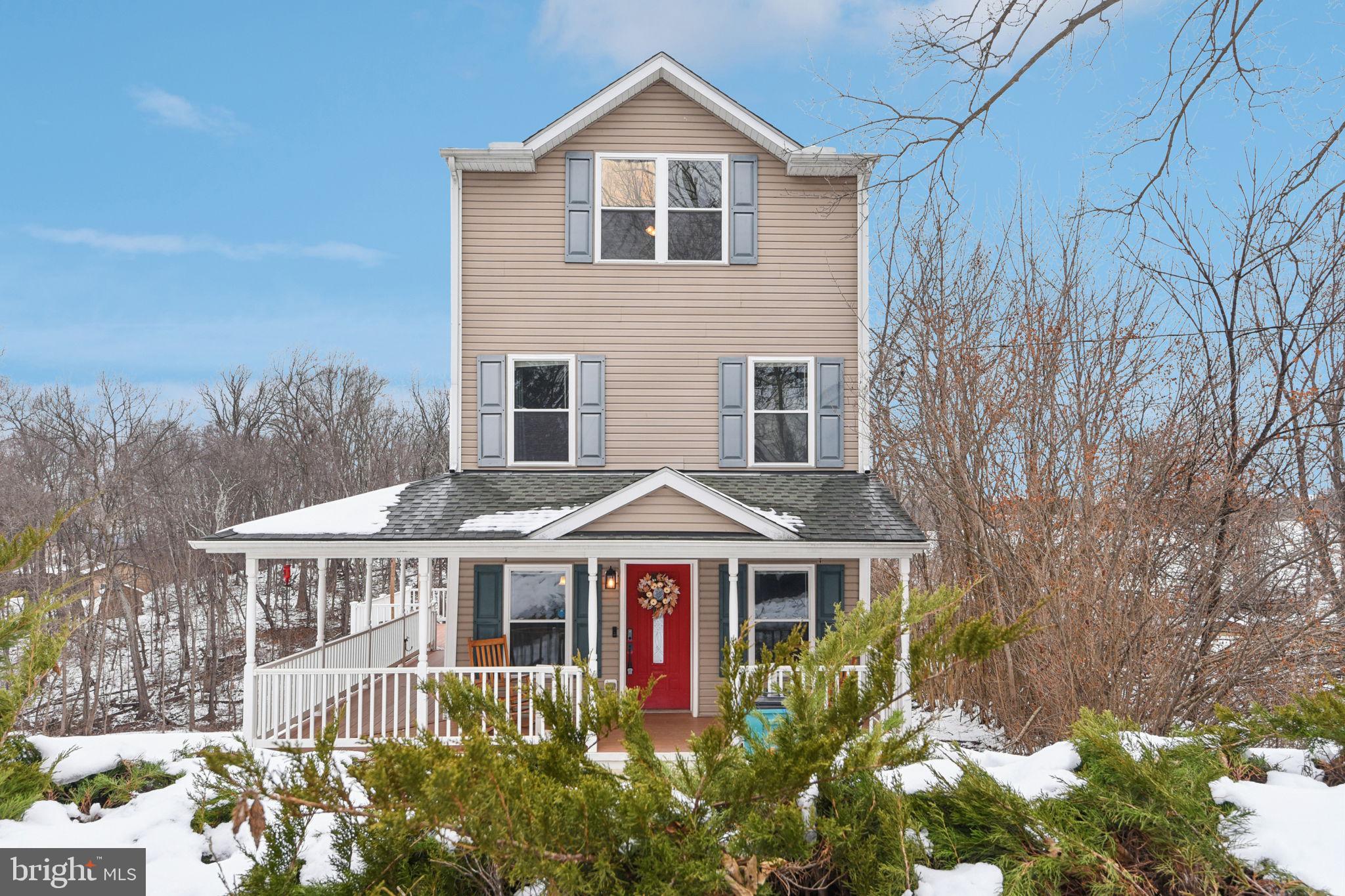 14844 Toll Road New Windsor, MD 21776 - Photo 1 of 30 a front view of a house with a garden