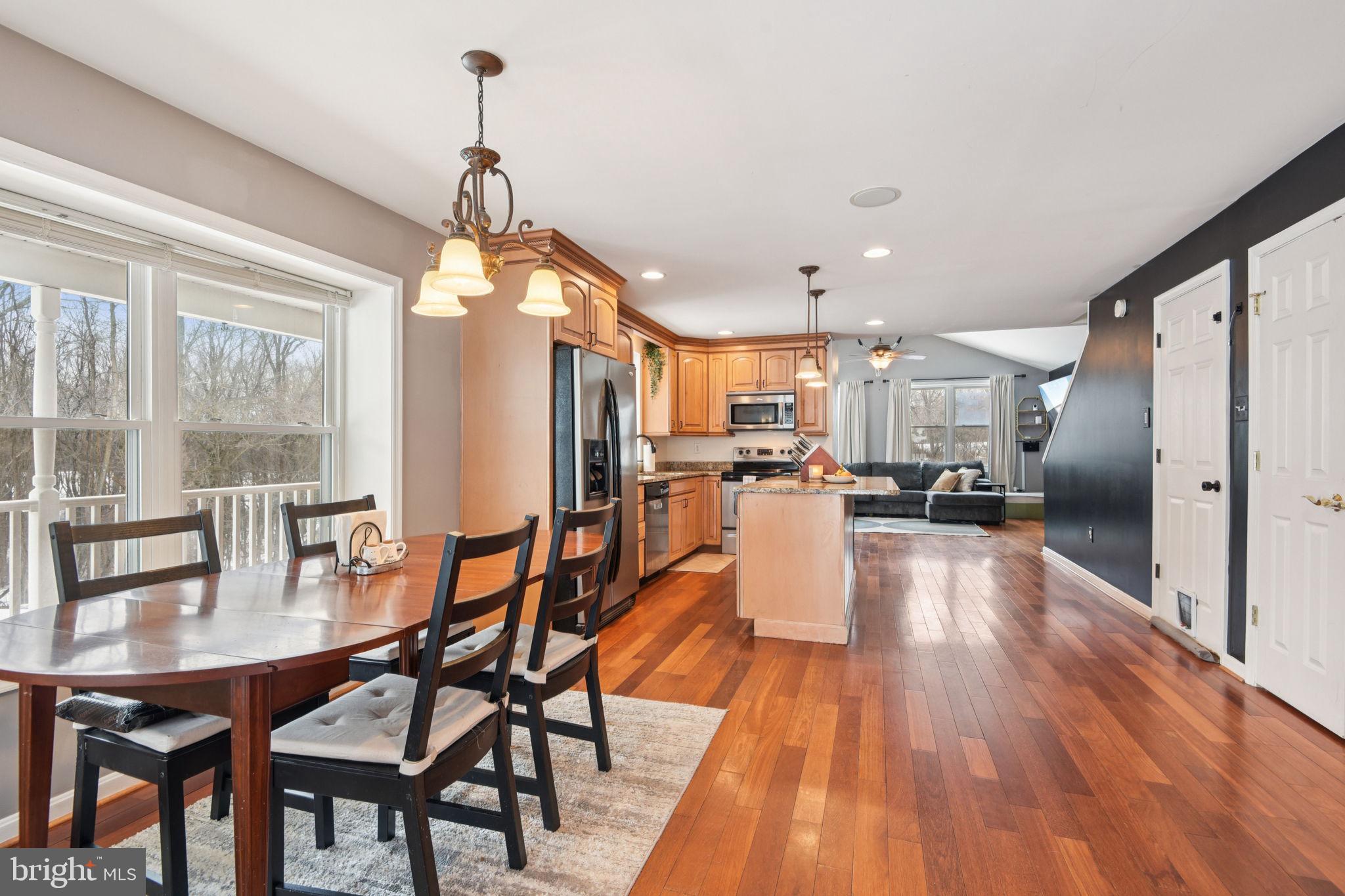 14844 Toll Road New Windsor, MD 21776 - Photo 11 of 30 a dining room with furniture and wooden floor