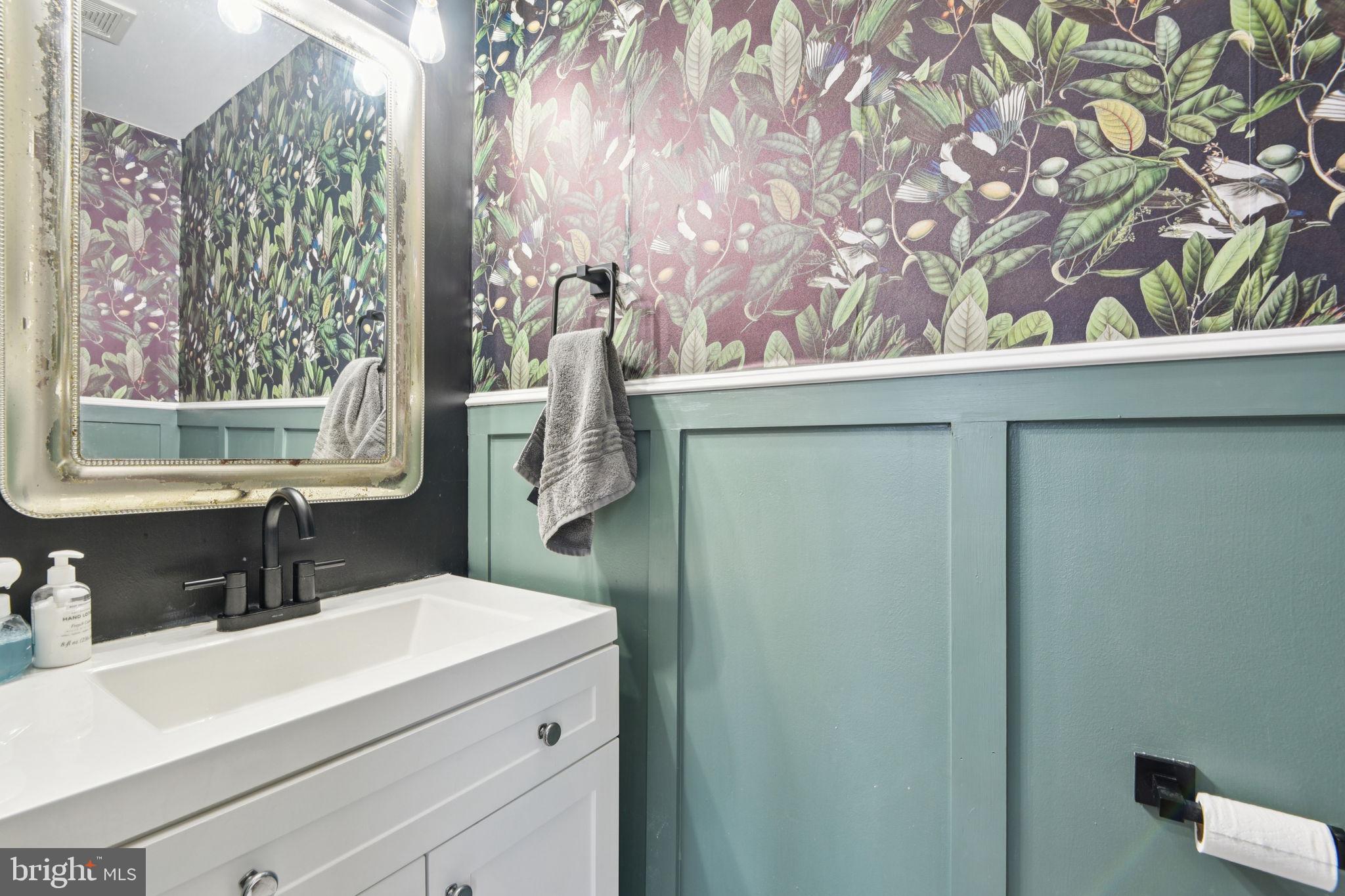 14844 Toll Road New Windsor, MD 21776 - Photo 16 of 30 a bathroom with a sink and a mirror