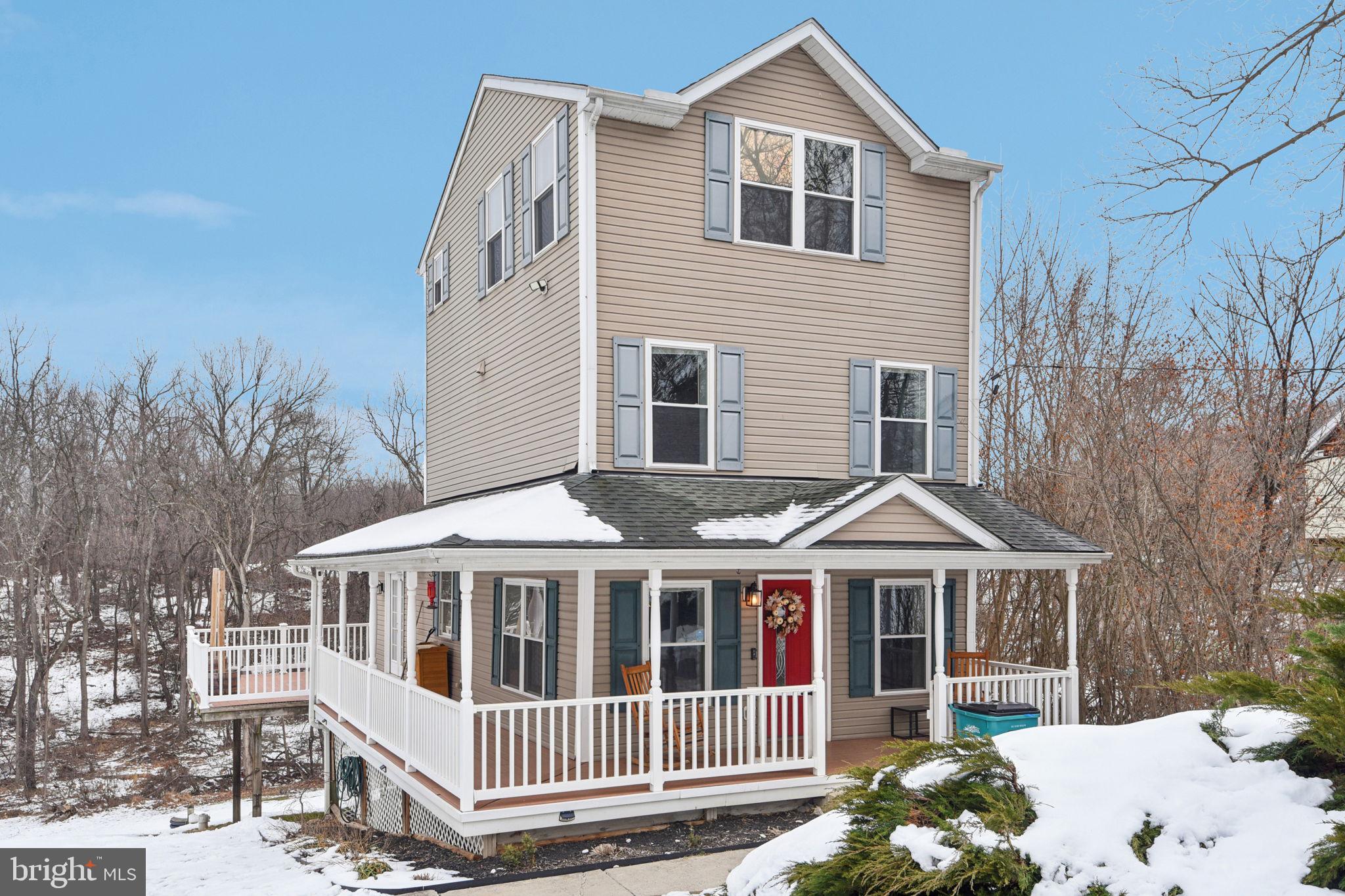 14844 Toll Road New Windsor, MD 21776 - Photo 2 of 30 a front view of a house with a yard