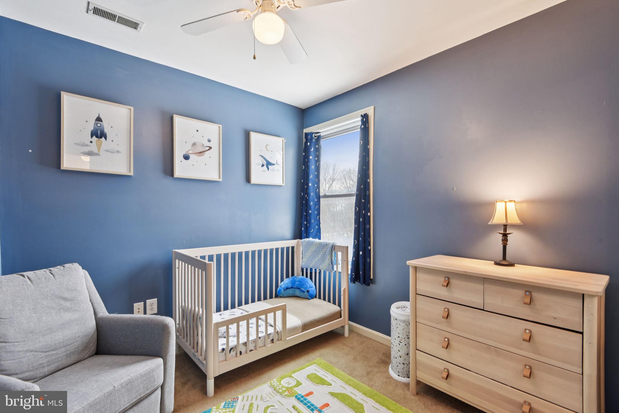 14844 Toll Road New Windsor, MD 21776 - Photo 21 of 30 a bedroom with a bed and a couch