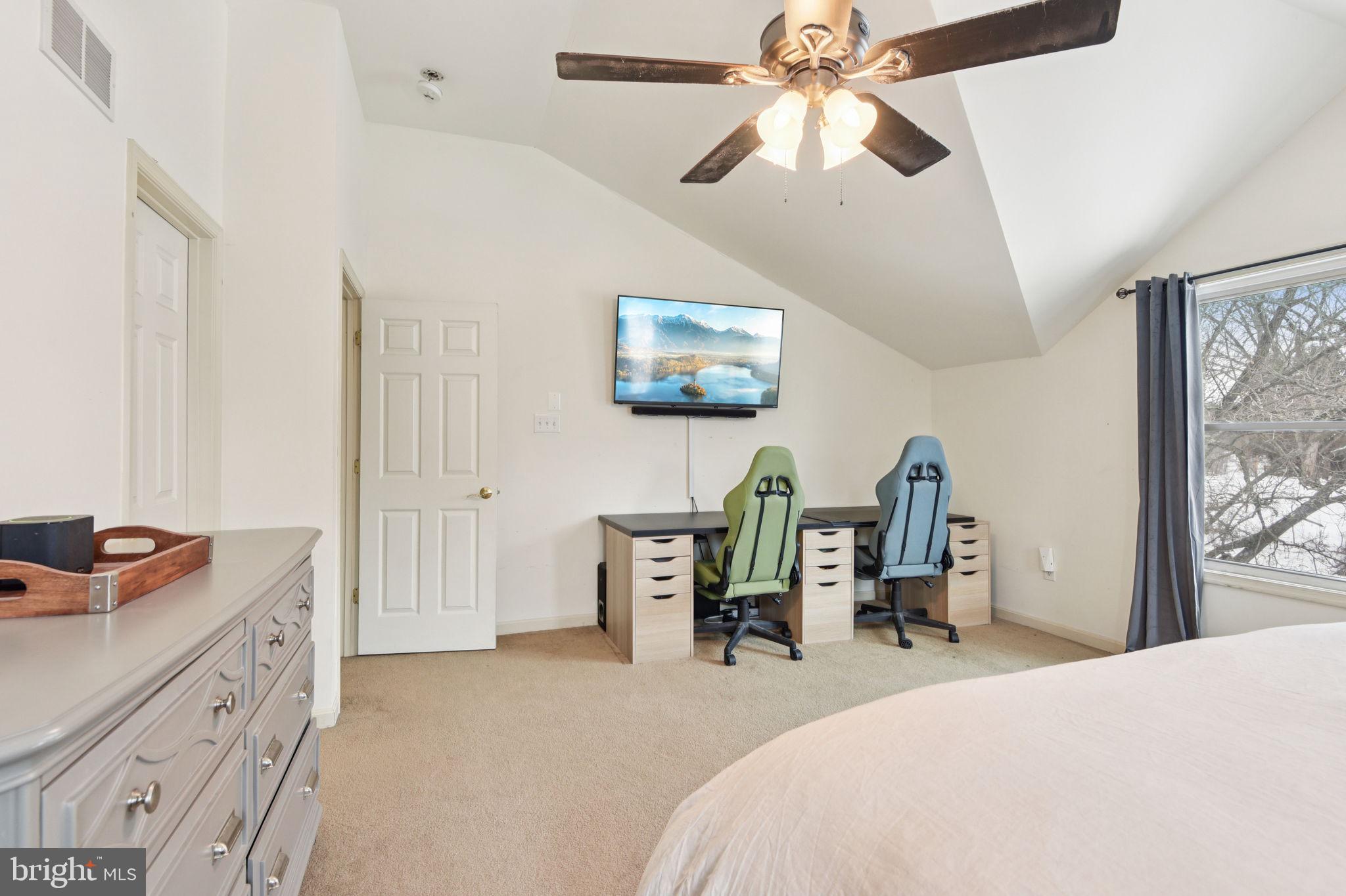 14844 Toll Road New Windsor, MD 21776 - Photo 26 of 30 a bedroom with a bed and a chandelier