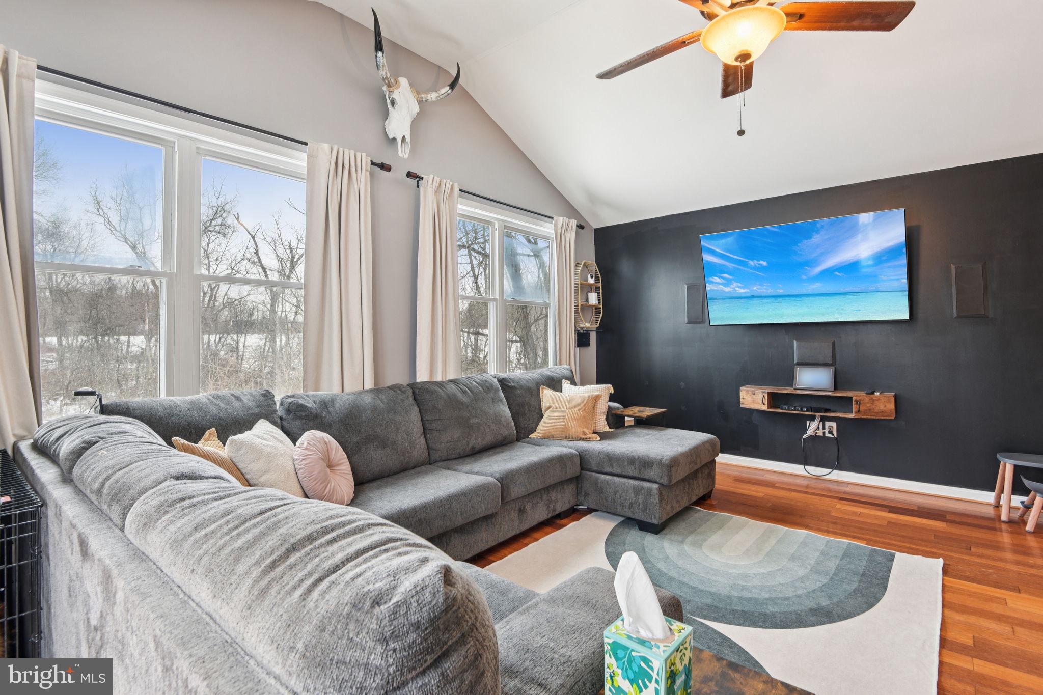 14844 Toll Road New Windsor, MD 21776 - Photo 5 of 30 a living room with furniture a large window and a flat screen tv