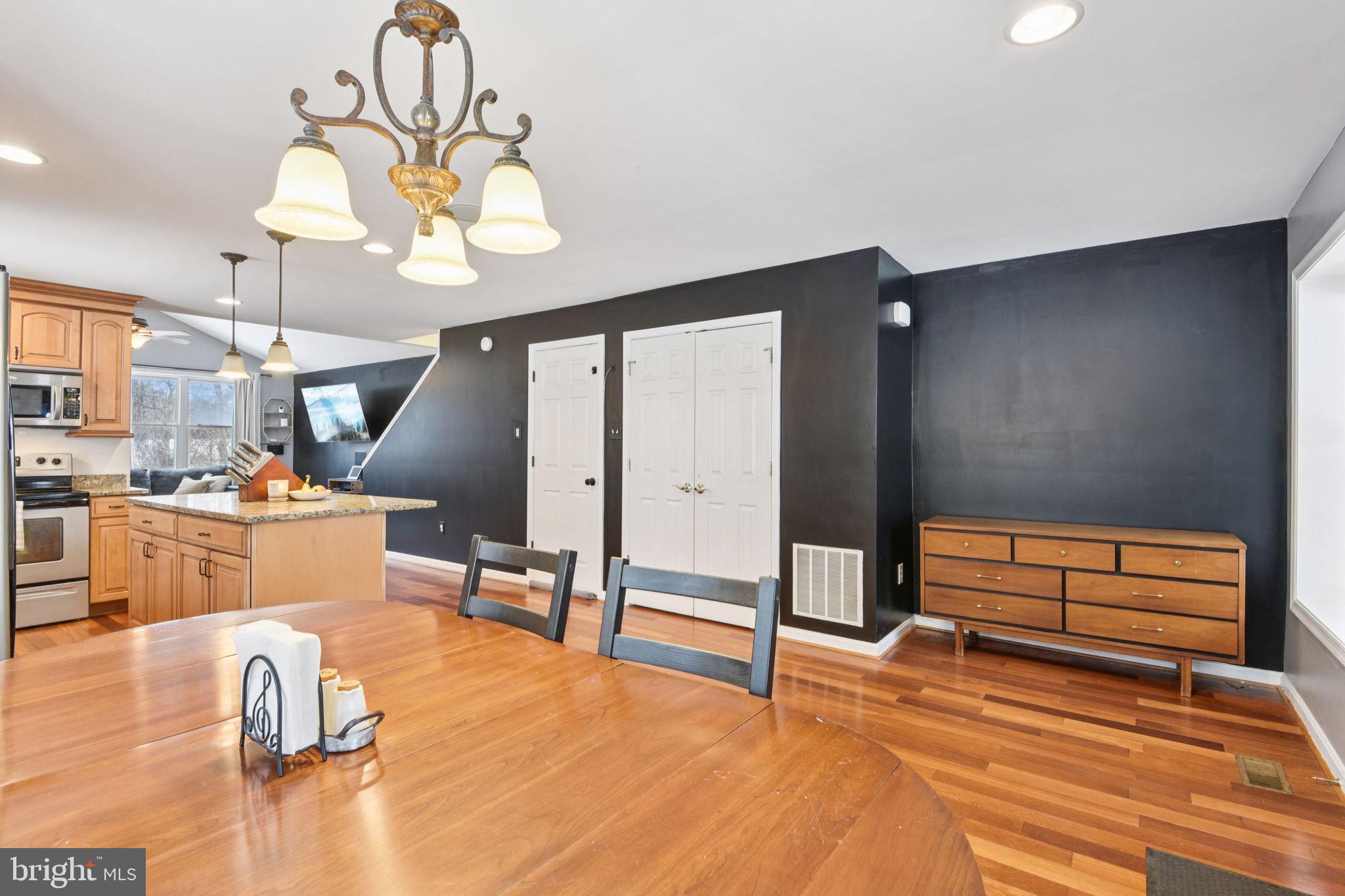 14844 Toll Road New Windsor, MD 21776 - Photo 9 of 30 a room with lots of white furniture and a chandelier