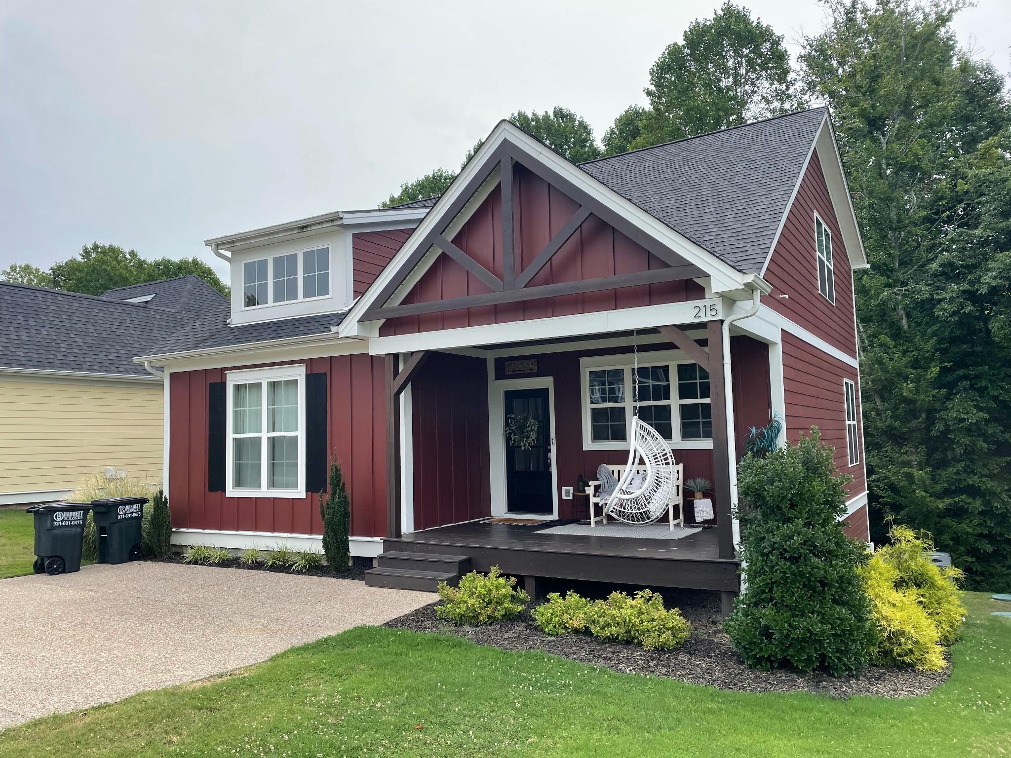 a front view of a house with a yard table and chairs