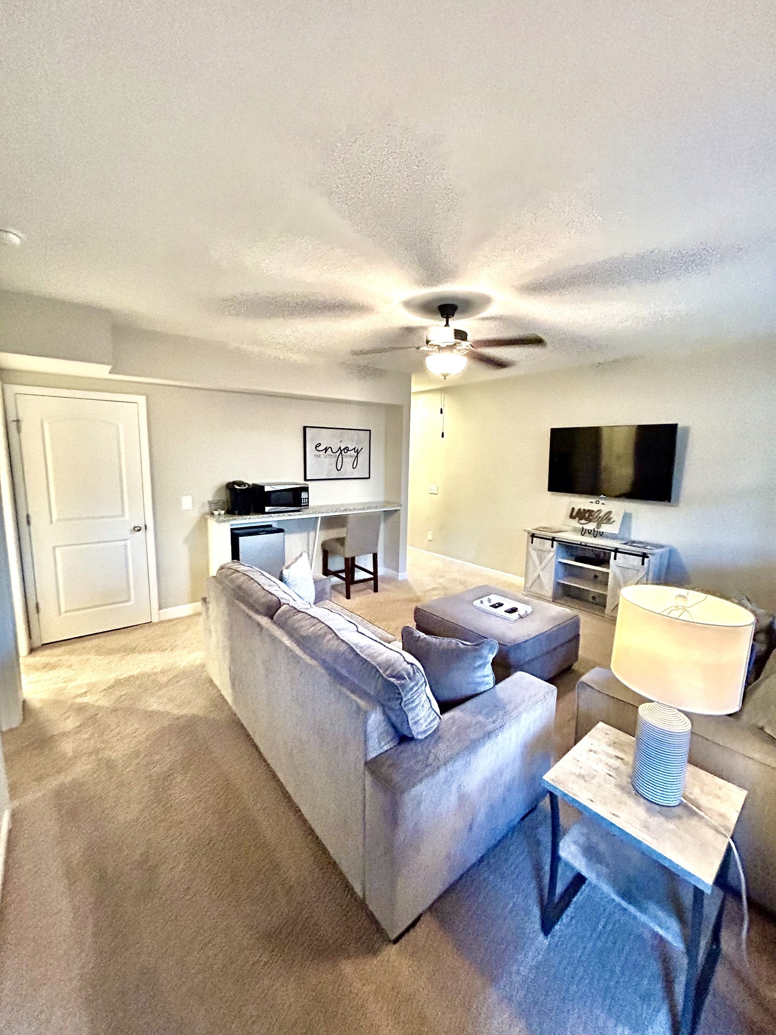 215 Evans Drive Tullahoma, TN 37388 - Photo 19 of 44 a living room with furniture and a flat screen tv