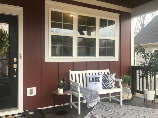 a view of a chair and table in front of house