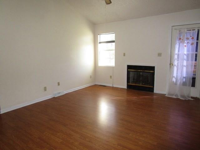 2704 The Great Road Fieldale, VA 24089 - Photo 4 of 14 an empty room with wooden floor and windows