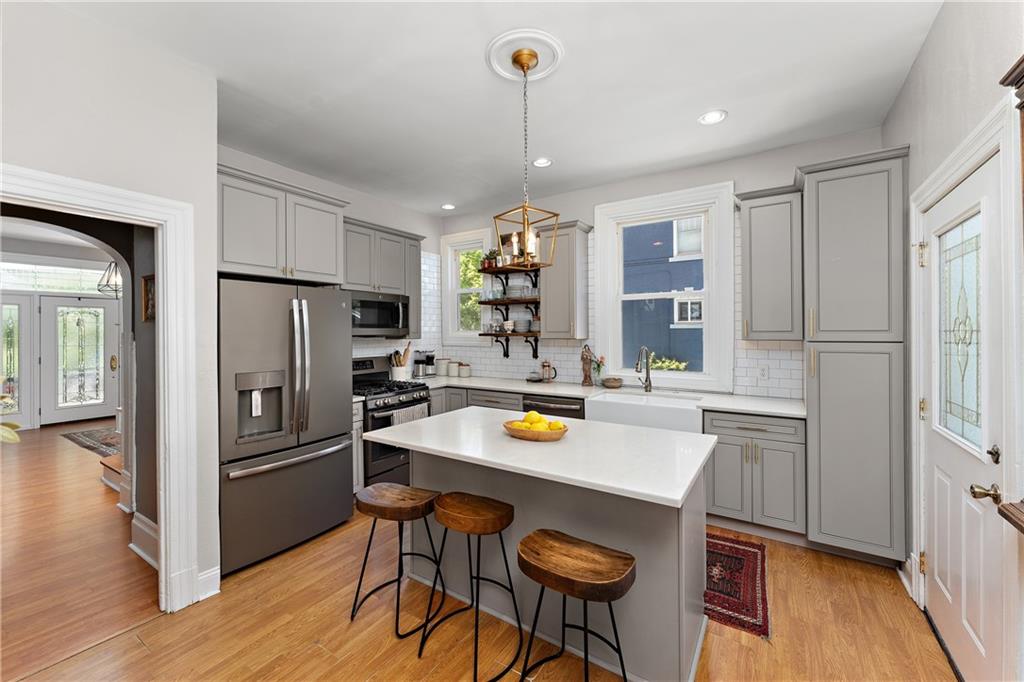 709 Maple Lane Sewickley, PA 15143 - Photo 13 of 31 Updated kitchen with lots of natural light and an island you can sit at.
