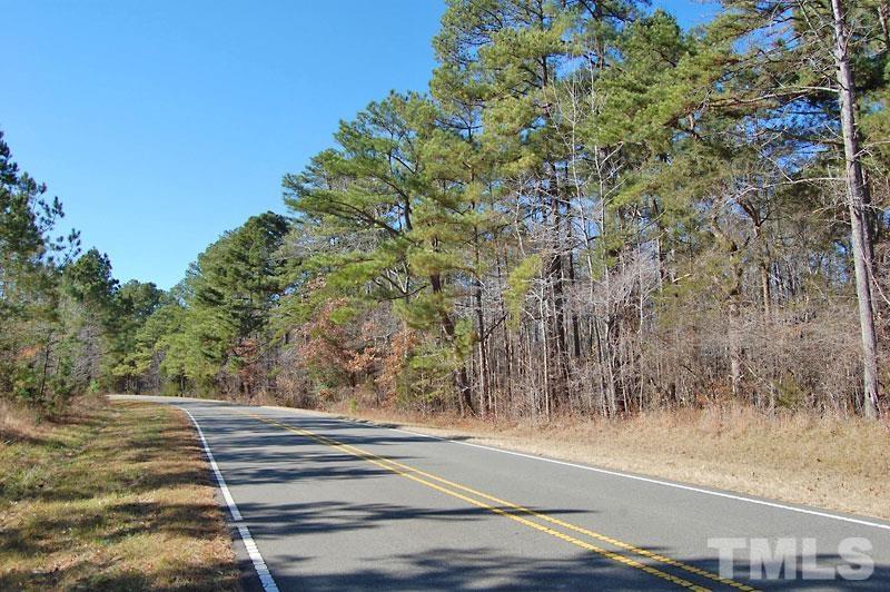 3747 Old Allensville Road Roxboro, NC 27574 - Photo 2 of 45 a view of a yard with large trees