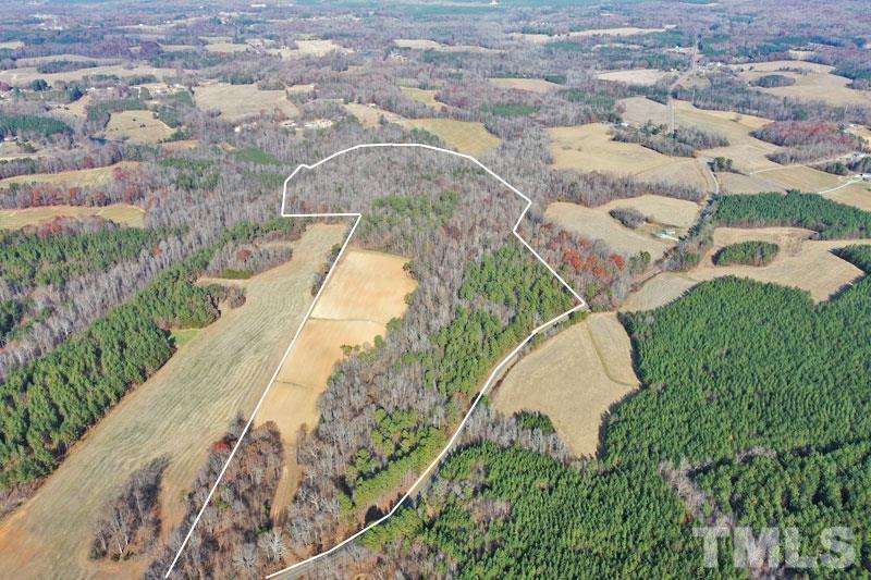 3747 Old Allensville Road Roxboro, NC 27574 - Photo 8 of 45 an aerial view of a house with a yard and lake view