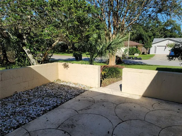 a view of a yard with a sitting area